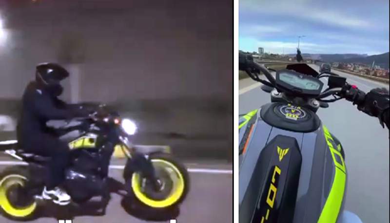 Motosikleti bir təkər üzərində sürən şəxsi 