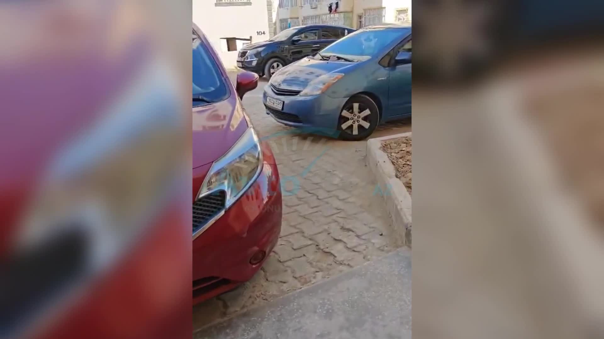 Binanın girişini zəbt edən qadın sürücü sakinləri boğaza yığdı